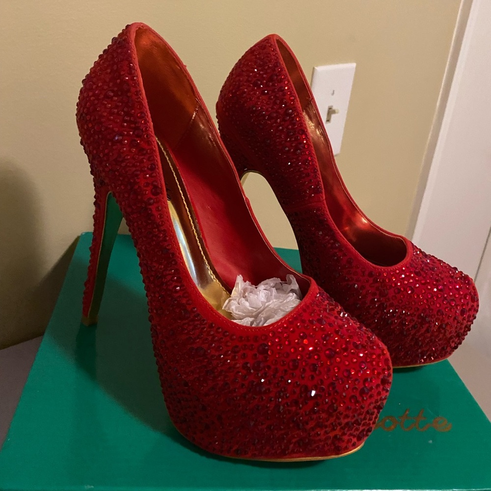Size 7 1/2 Red bling Moscoto pumps. New